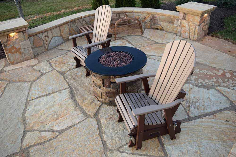 Bring the element of fire into your backyard with a fire pit or landscape fireplace.